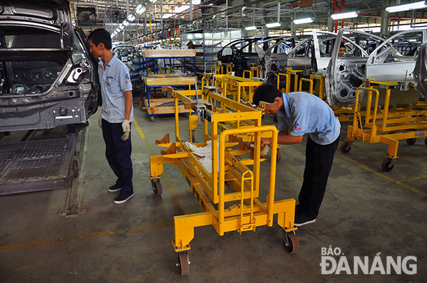  Workers at a local automobile factory