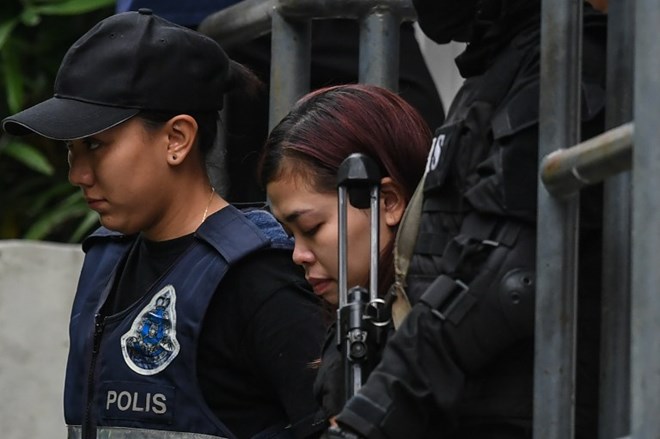 Lực lượng an ninh đã bảo vệ rất chặt nữ nghi phạm Indonesia. (Ảnh: AFP)