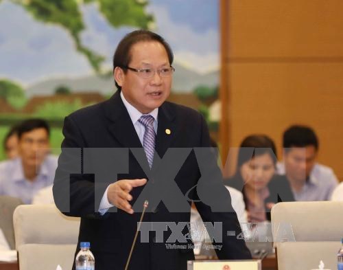 Bộ trưởng Trương Minh Tuấn trả lời tại phiên chất vấn chiều 18/4. (Ảnh: Phương Hoa/TTXVN)