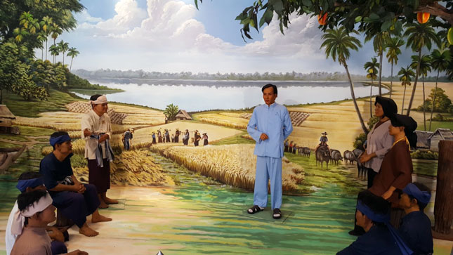 Bức tranh lớn đặt tại khu di tích Nakhon Phanom -  Chàng thanh niên Thầu Chín (bí danh của Chủ tịch Hồ Chí Minh thời kỳ hoạt động tại Thái Lan - năm 1927, 1928) đang giảng giải về “Con đường cứu nước -  giải phóng dân tộc”. Ảnh: P.Q.T