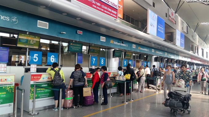 Passengers check in at the Da Nang Airport. The city connects 24 international flights each day. — VNS Photo Cong Thanh 