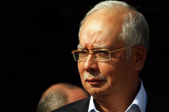 Former Malaysian PM Najib Razak charged with money laundering, power