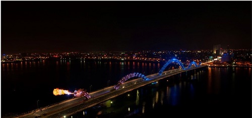 The Rong Bridge has the dragon sections changing colors at night. Photo credit: ASA