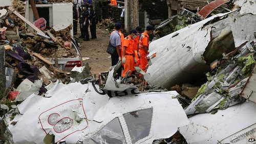 The plane came down in buildings in a village near Magong airport in Penghu