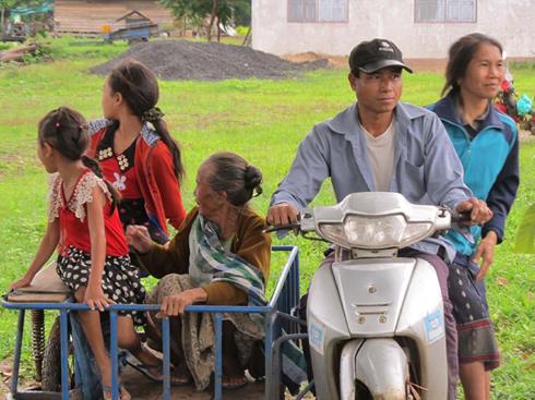    A man bringing his family members for free medical examinations and medicines