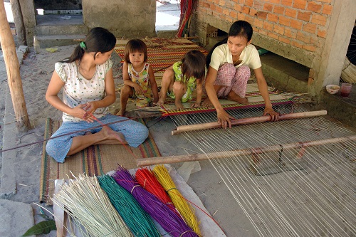  The sedge fibres are woven in a mat loom operated by two people   