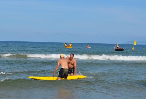   Two of a three-member team in the surfboard rescue relay.