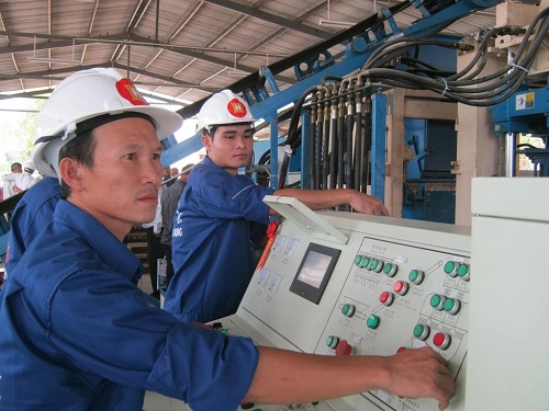 Workers at the new manufacturing plant