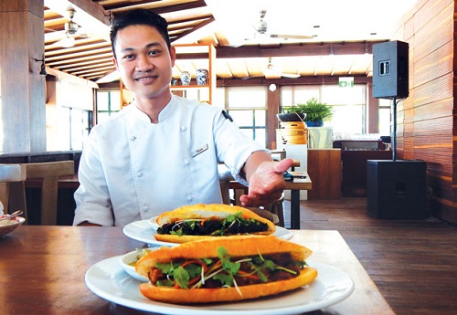 A cook from the Hyatt Regency Danang Resort & Spa introducing braised pork belly and grilled pork baguettes