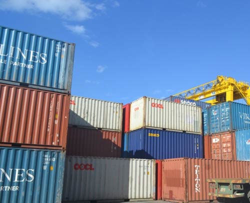 Containers of second-hand tyres, imported by Indevco, awaiting collection from Da Nang Port