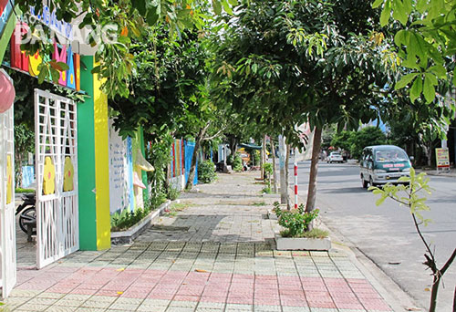 A clean and green space in front of a local business