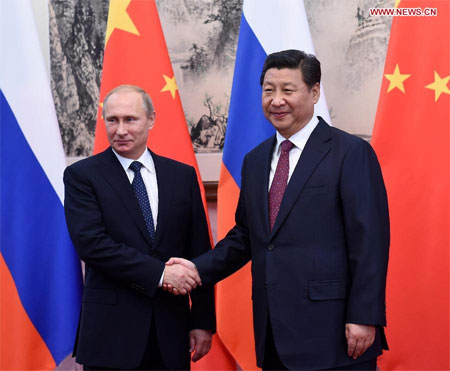 Tổng thống Nga Putin găp Chủ tịch Trung Quốc Tập Cận Bình (Ảnh Chinanews)