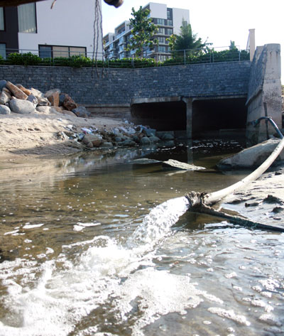 Wastewater being discharged into the sea from a local drain