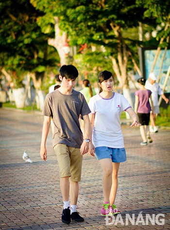   A young couple walking on the pedestrian promenade