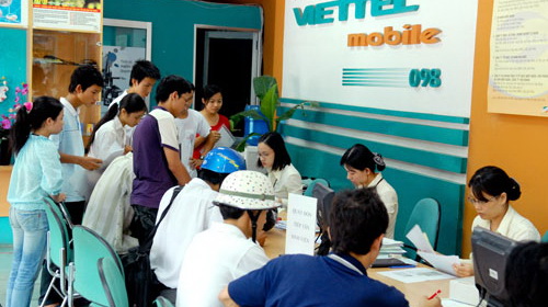Customers making their bill payments at a customer service center of Viettel.