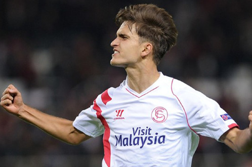 Denis Suarez ăn mừng bàn mở tỉ số cho Sevilla - Ảnh: AFP