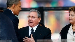 President Raul Castro (second, left) and his US counterpart Barack Obama (first, left) shake hands at the funeral of late South African President Nelson Mandela 