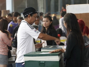 A Thai man casts his vote on February 2