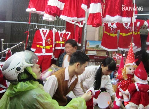  Shoppers busy buying Christmas items at a local store