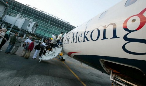 Passengers board an Air Mekong aircraft at Tan Son Nhat International Airport in Ho Chi Minh City in southern Vietnam.