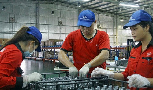 Kawasaki Heat Metal Vietnam employees work at the company's plant in Binh Duong Province