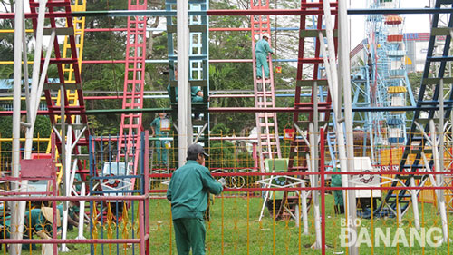 Doing maintenance work on the park’s amusement rides