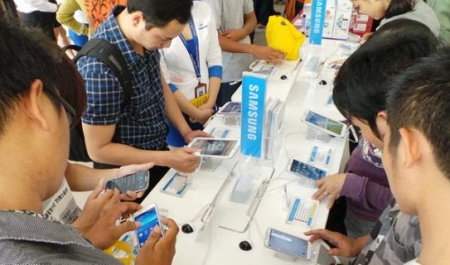 Vietnamese consumers test out Samsung smartphones at a store in Ho Chi Minh City.