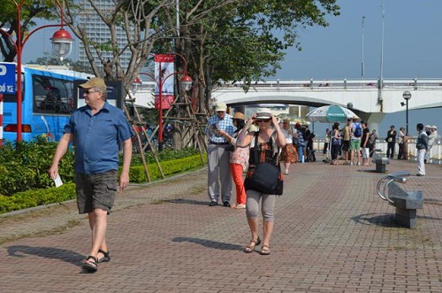 Cruise ship passengers enjoying a walk along Bach Dang Street