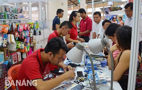  Salespeople (in red) in a local telephone store