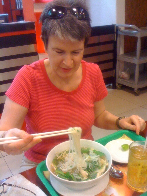 Janet with her first bowl of pho