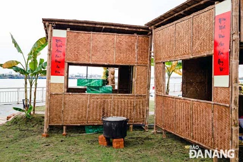   The re-creation of a Vietnamese rural village including thatched cottages, Tet parallel sentences, yellow apricot blossoms, and“banh chung” (square glutinous rice cakes).