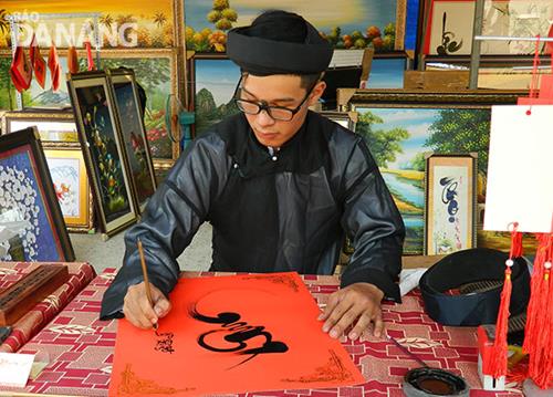    A young scholar doing calligraphy