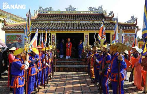   A prayer ceremony in front of the communal house.