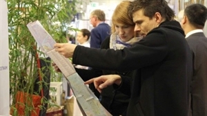 Visitors look at a map of Viet Nam