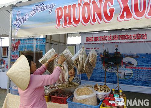   … and displaying seafood specialties, including dried cuttlefish, fish and fish sauce.