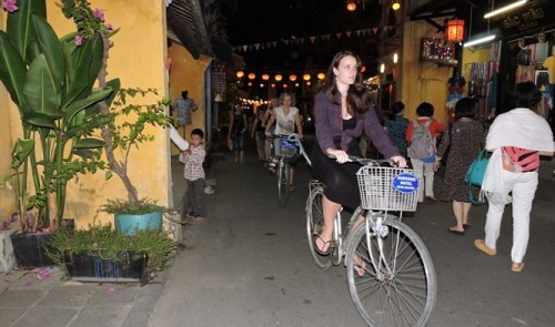 Foreigners are seen riding bikes in UNESCO-recognized Hoi An Ancient Town