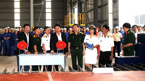 Pressing buttons to start the building of the two boats