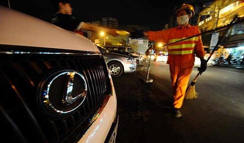 A Toyota Lexus car is parked in downtown Ho Chi Minh City.