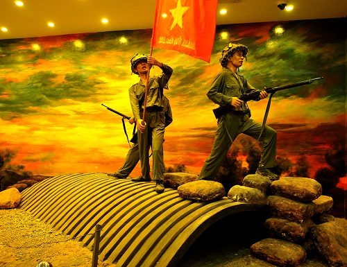  Model of Vietnamese soldiers putting the national flag of Viet Nam on top of the  command bunker of French General De Castries on the Dien Bien Phu battlefield