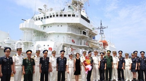 Japanese naval officers and crew members (in their white uniforms) and their hosts