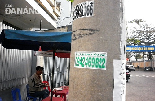 Illegal advertisements on a local power pole