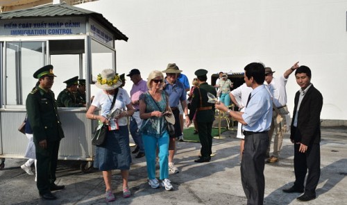 International tourists pass an immigration check to enter Thua Thien-Hue Province