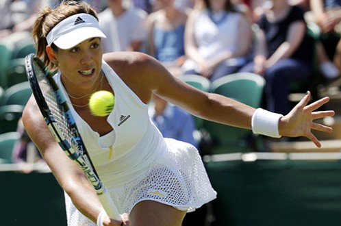 Tay vợt Garbine Muguruza thi đấu ở Wimbledon 2015 - Ảnh: Reuters