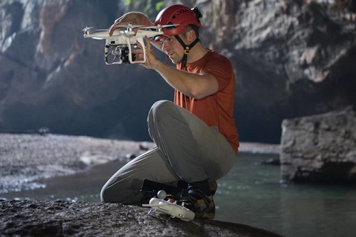 American photographer Ryan Deboodt is pictured operating a drone camera during his second entry to Son Doong Cave. Photo: David Lloyd