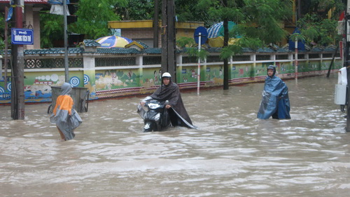 This file photo shows a street in Ha Noi submerged after a heavy rain.