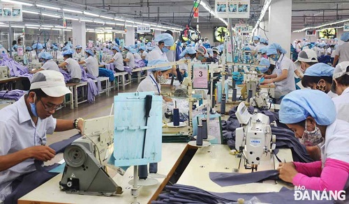 Workers at a local textiles and garments business