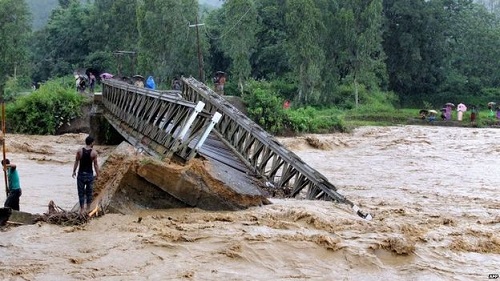 At least 20 people were killed after a landslip in the north-eastern state of Manipur buried a while village