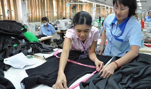 This photo shows Vietnamese workers making garments for export to overseas markets at Garmex Saigon JSC in 2015. Tuoi Tre