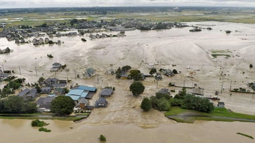 The Kinugawa River in Joso burst its bank on Thursday, flooding homes