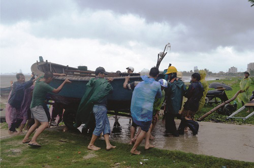 A fishing boat being brought ashore